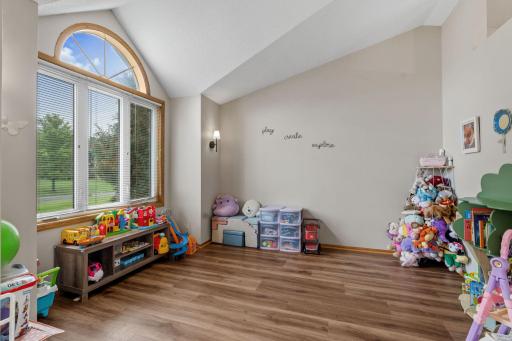 This room has so many possibilities! Play area, home office, living room, dining room.... Lovely arched window adds a light bright space