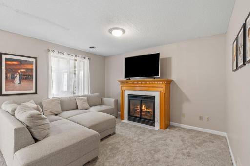 Curl up with a good book next to this cozy gas fireplace in main level family room