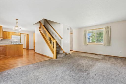 Main floor offers spacious living area, formal dining room, informal dining off of kitchen, laundry room, half bath.