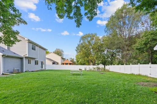 Beautiful backyard with privacy fence and shed.