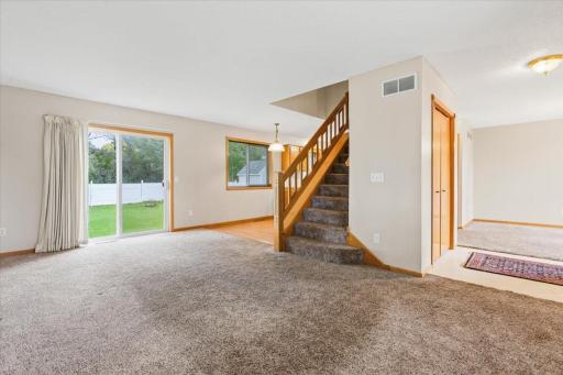 Living room area offers walk out to back yard. Currently no deck.