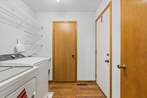 Laundry room off of kitchen 1/2 bath and entrance to garage.