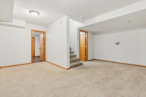 Basement area offers family room - bedroom with egress window - 3/4 bath & storage area.