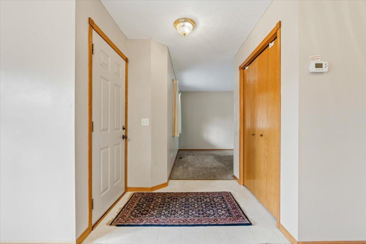 Entry way opens up to living room to left and formal dining to right of entry.