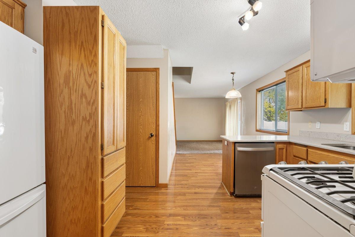 Informal dining off of kitchen and living room area with patio door.