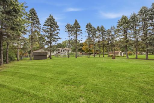 A service door on the backside of the garage provides convenient access to the backyard, while an in-ground pet-safe fence system is also included.