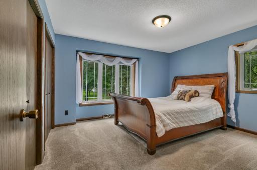 The primary bedroom features dual bifold closet doors, new pull down shades and the trim has been replaced.