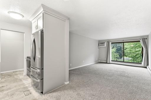 A great view of theThe updated kitchen flows into the dining and generously sized living room.