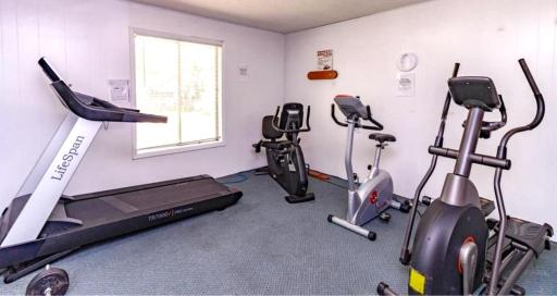 Stay active close to home with a community fitness room featuring a variety of cardio equipment.