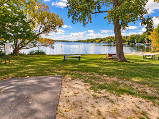 Lake Owasso access is a standout community amenity, offering a sandy shoreline, picnic tables and a beautiful place to enjoy time by the water