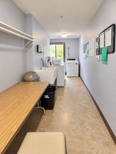 Convenient community laundry rooms on each floor feature multiple washers and dryers, utility sink and space for sorting and folding.