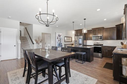 Open-concept floor plan featuring a stunning wall of windows that fills the home with natural light!