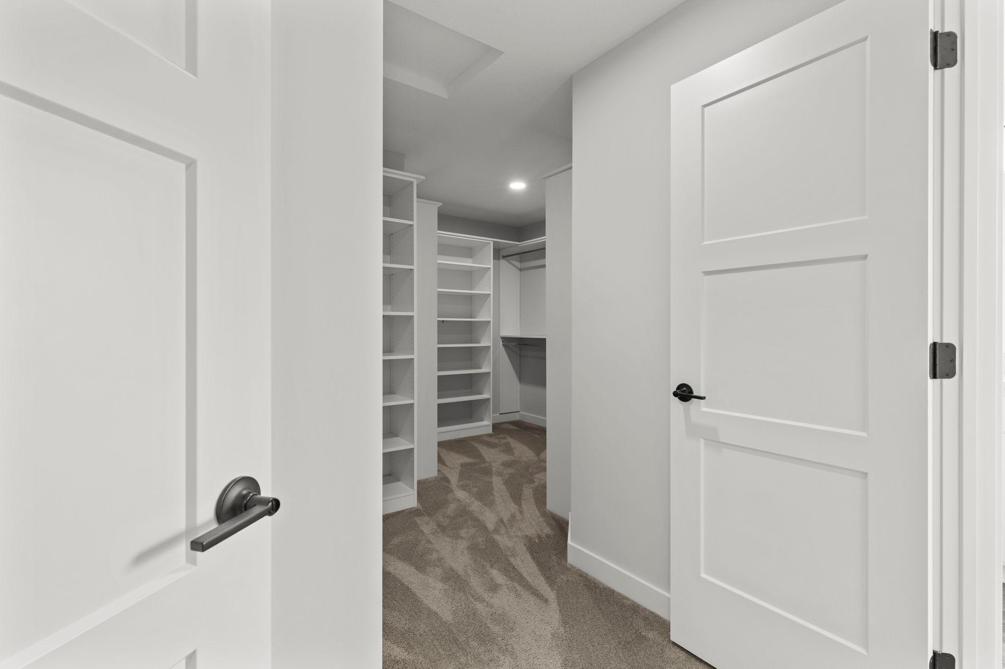 The walkthrough closet connects directly to the upper-level laundry room.
