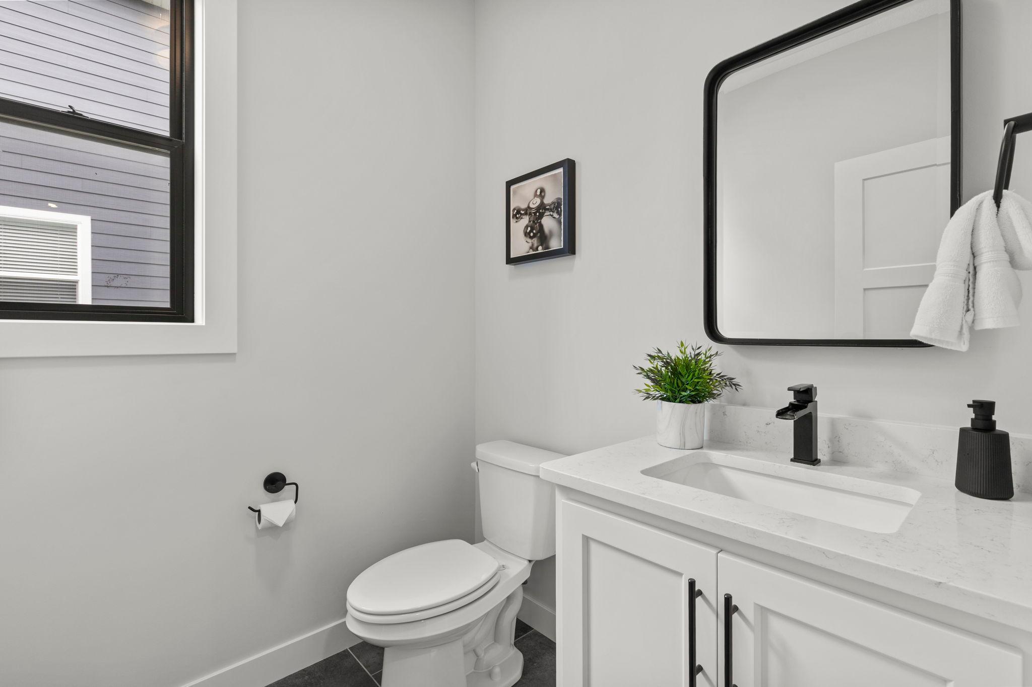 The mudroom provides convenient access to a half bathroom and the attached, heated and insulated three-car garage.