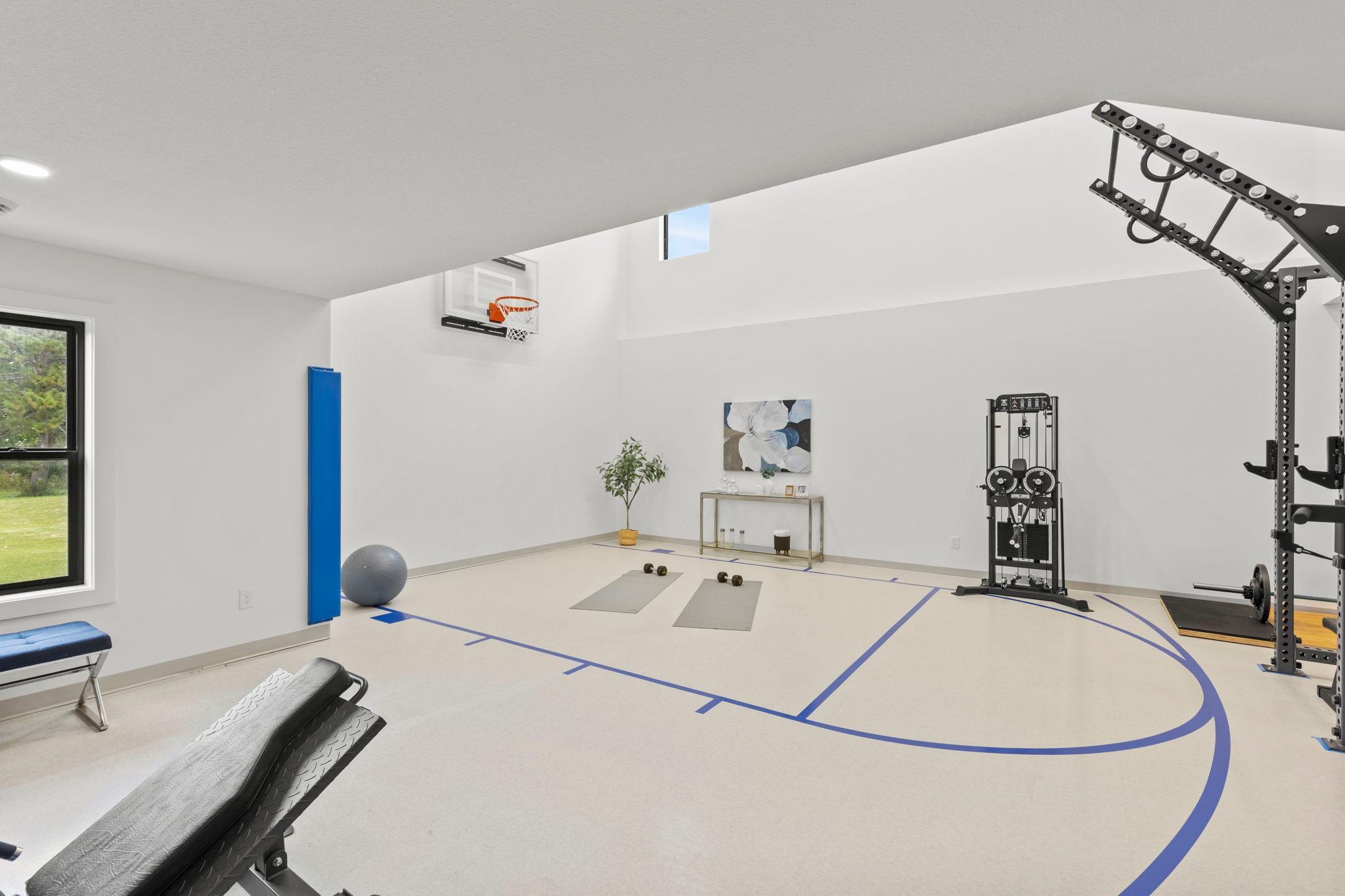The at-home fitness and recreation area, is complete with quality gym equipment and an indoor sports court.