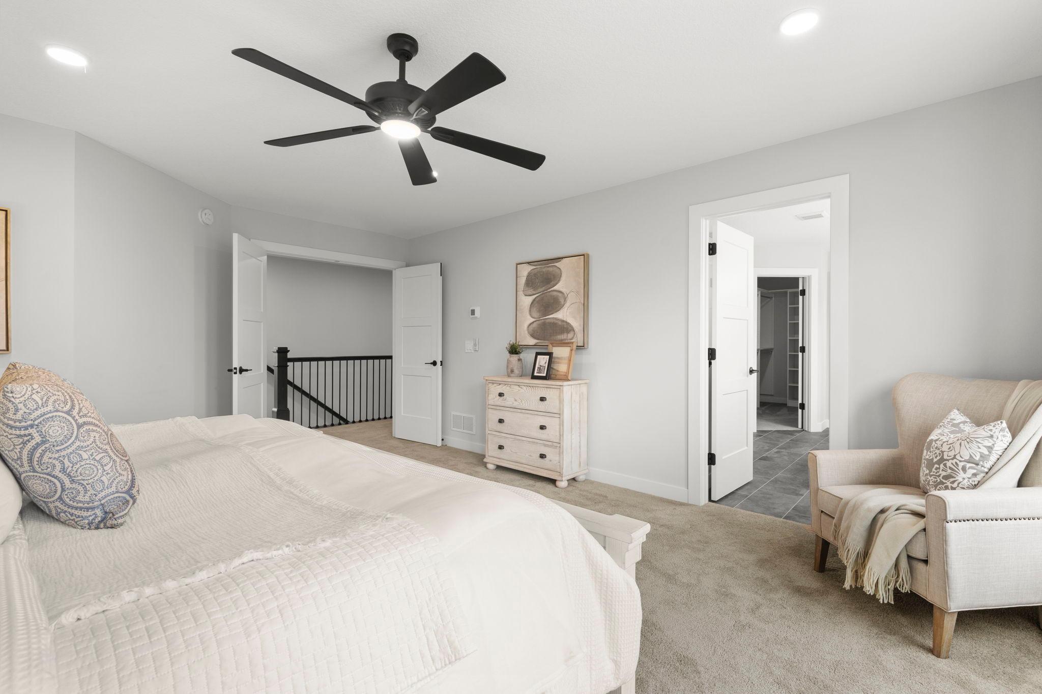 An alternate view of the primary bedroom, highlighting the entrance to the spacious primary suite.