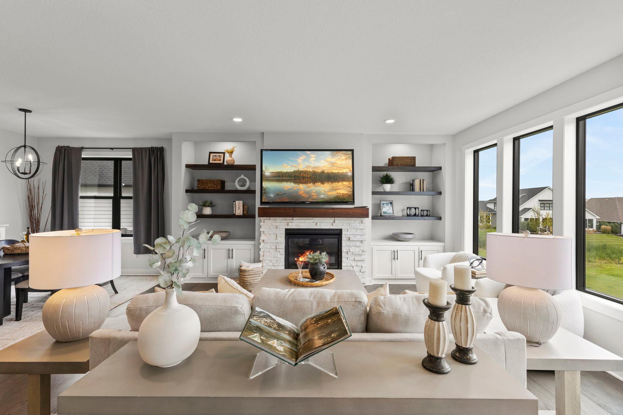 Cozy gas-burning fireplace with a wood mantel creates a warm focal point for the living room.