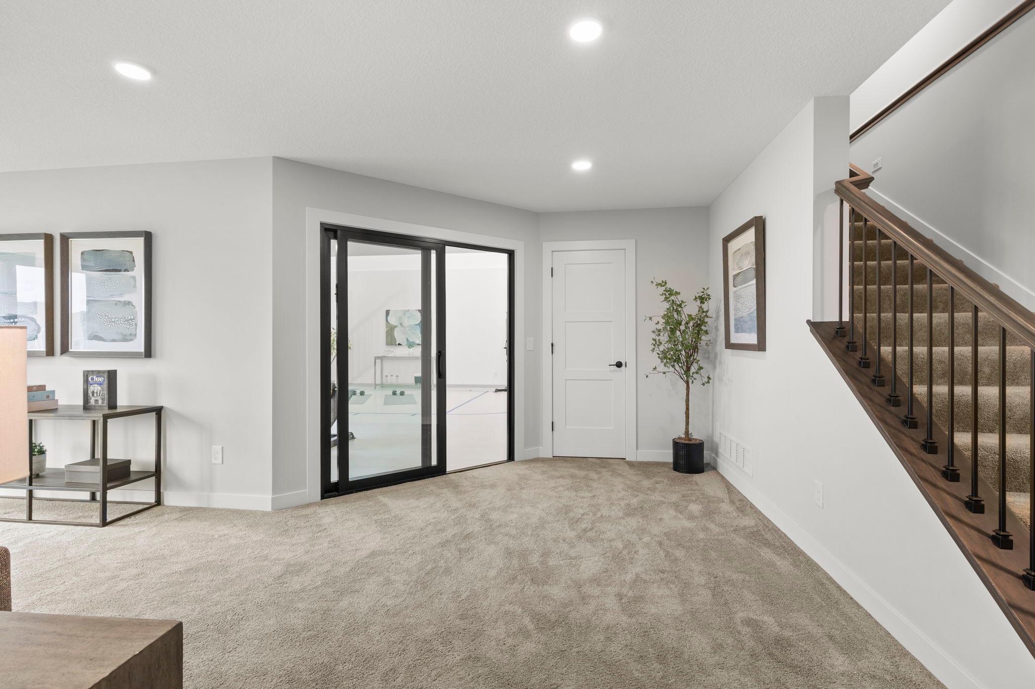 Rounding out the lower level is an incredible at-home fitness and recreation area.