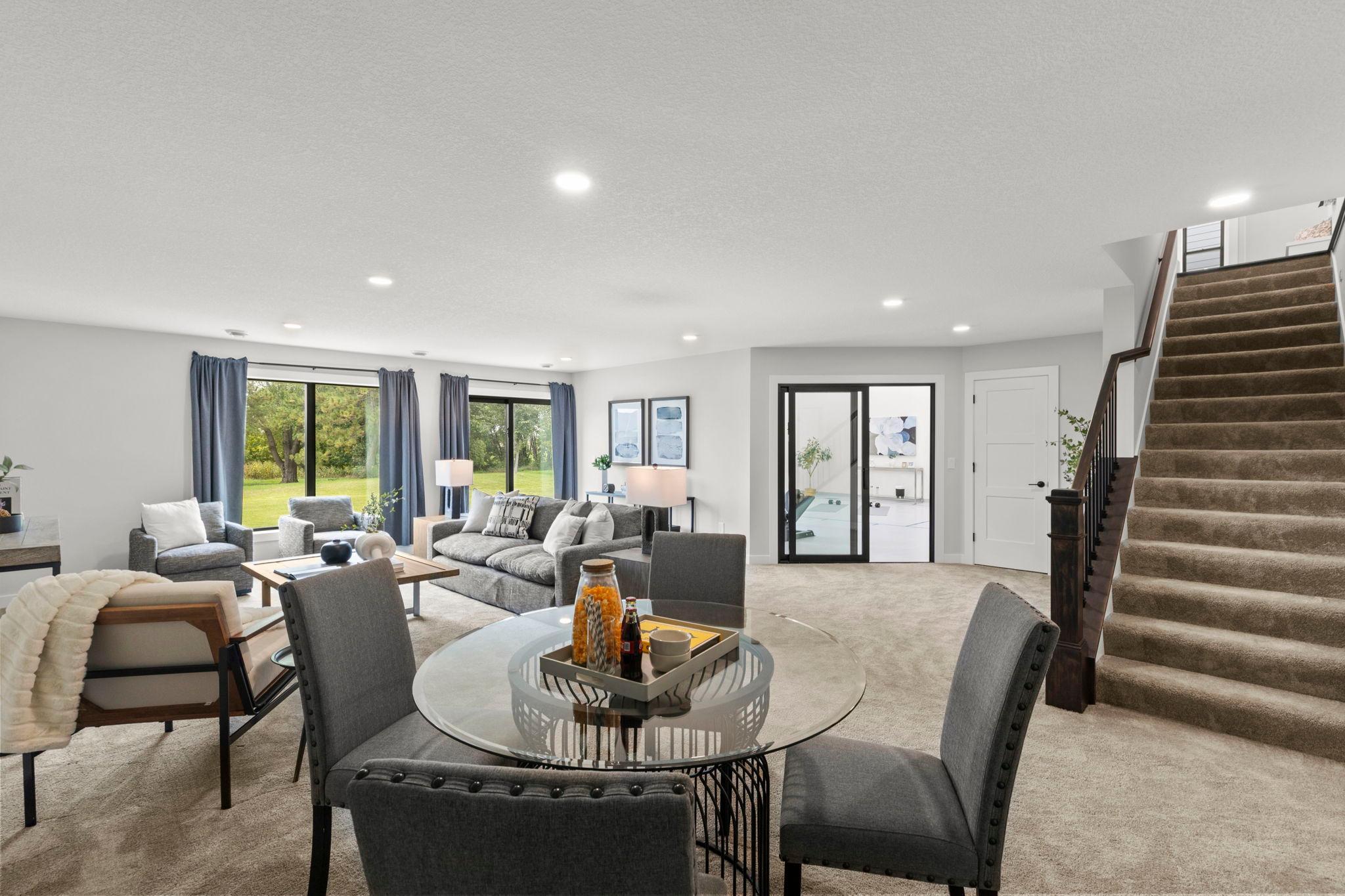 The lower level is another standout feature of this exceptional home, offering a spacious family room with carpeting, recessed lighting, and walkout access to the patio.