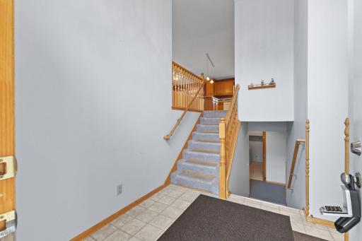The spacious entryway offers convenient access directly from the attached 3-car garage. This versatile space also provides easy access to the lower level, creating a practical flow for everyday living while offering plenty of room.