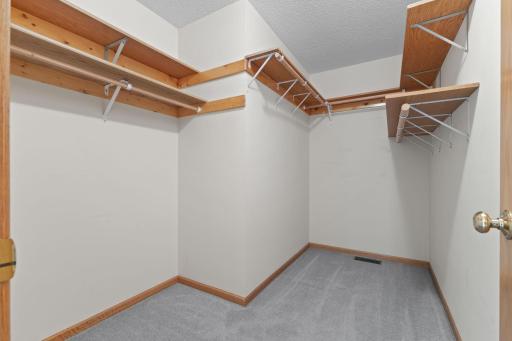 The primary suite features a large walk-in closet, providing exceptional storage and organization space. Thoughtfully designed for comfort and convenience, this spacious retreat offers plenty of room to unwind at the end of the day.