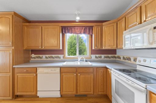 Enjoy the bright, open floor plan featuring vaulted ceilings, abundant natural daylight, and a spacious kitchen with a center island that serves as the heart of the home.