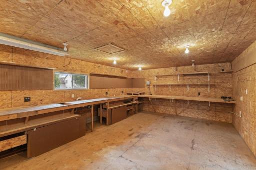 The impressive 26' x 16' workshop is fully insulated and heated, providing a comfortable, year-round workspace for woodworking, hobbies, crafts, or DIY projects. With ample room for tools, equipment, and workbenches.