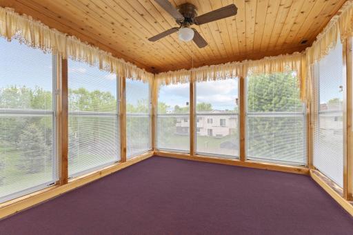 Just off the dining room, the inviting 3-season porch provides the perfect place to relax and enjoy views of the quiet backyard. Surrounded by natural light, this peaceful retreat is ideal for morning coffee or evening conversations.