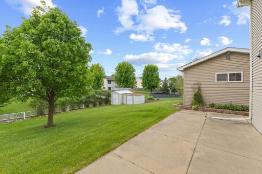 The well-maintained backyard provides a peaceful outdoor setting with plenty of space to relax, play, or garden. A spacious patio extends your living area outdoors, creating the perfect spot for summer barbecues and entertaining guests.