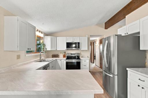 Beautifully updated kitchen with soft close cabinets, stainless steel appliances and a great view of the backyard out the kitchen window!