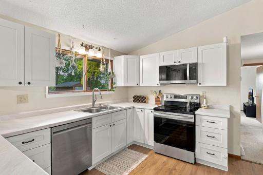 Beautifully updated kitchen with soft close cabinets, stainless steel appliances and a great view of the backyard out the kitchen window!
