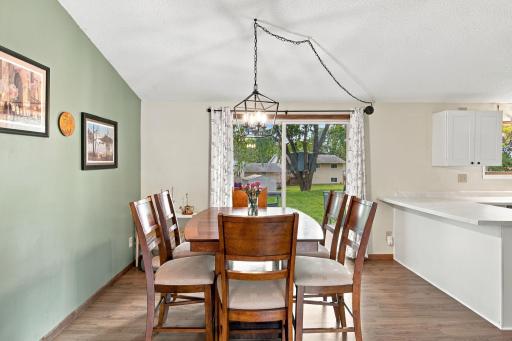 Main level dining room with a patio door out to the deck!