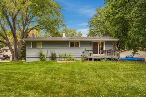 Nice flat backyard with a deck to enjoy the beautiful summer evenings.