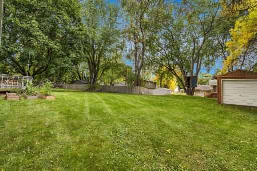 Large mature trees and a 10x20 storage shed located in the backyard!