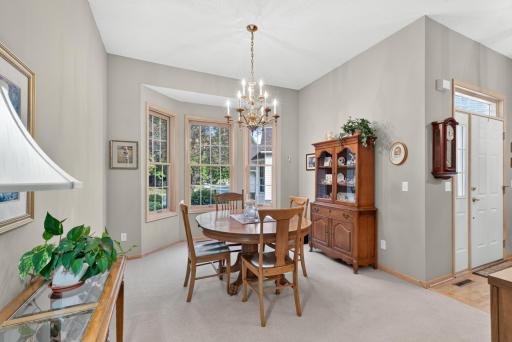 Comfortable dining space overlooking mature trees.