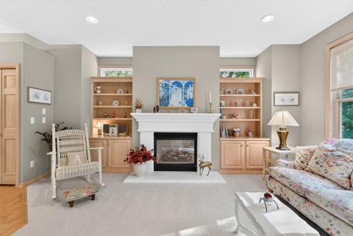 Warm fireplace gathering space with built-in character.