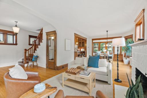 Living room with views to the staircase and dining area