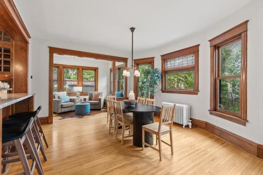 Dining area with original oak columns and cast-iron radiator