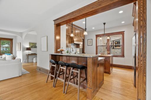 Oak-trimmed opening from dining area to kitchen