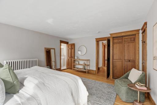 Primary bedroom suite with two closets (one a walk in) and bath access