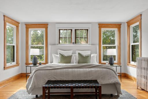 Primary bedroom suite with oak-trimmed windows