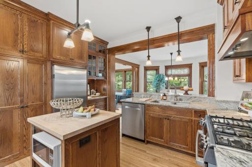 Fisher & Paykel refrigerator and glass-front cabinetry