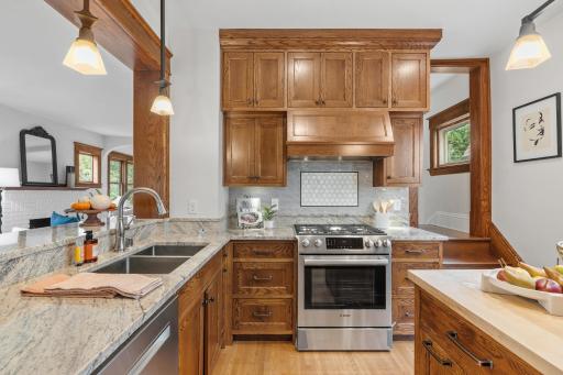 5-burner gas range, Bosch oven and wood cabinetry