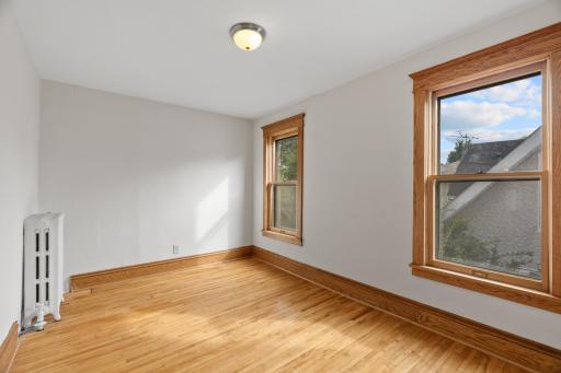 Second bedroom on upper level with hardwood floors