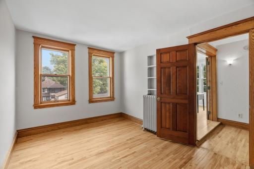 Third bedroom on upper level with hardwood floors
