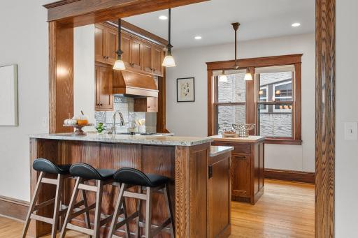 Kitchen peninsula with seating and granite counters
