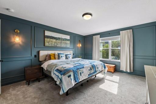 Primary bedroom overlooking private backyard