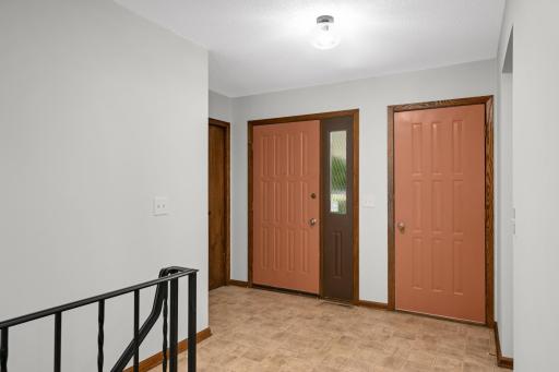 Front foyer - door on the left is the front door, door on the right leads out to the 2 car garage