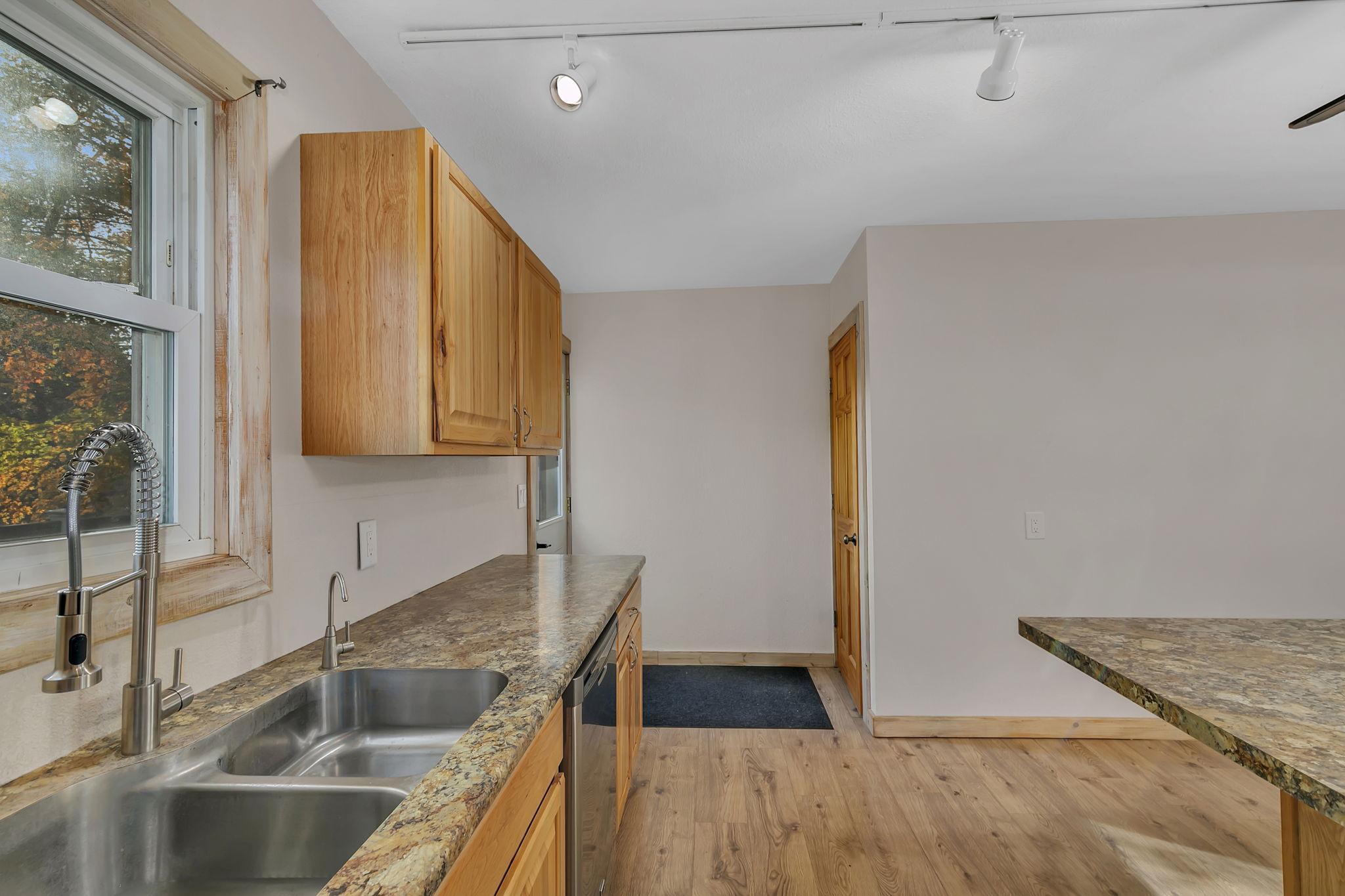 Access to basement and gorgeous back deck and yard