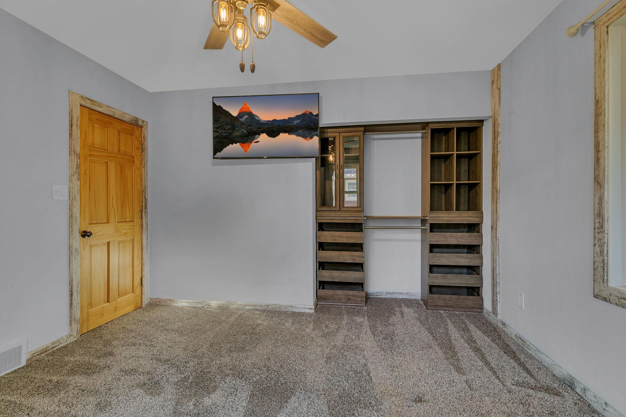Primary bedroom with build in closet